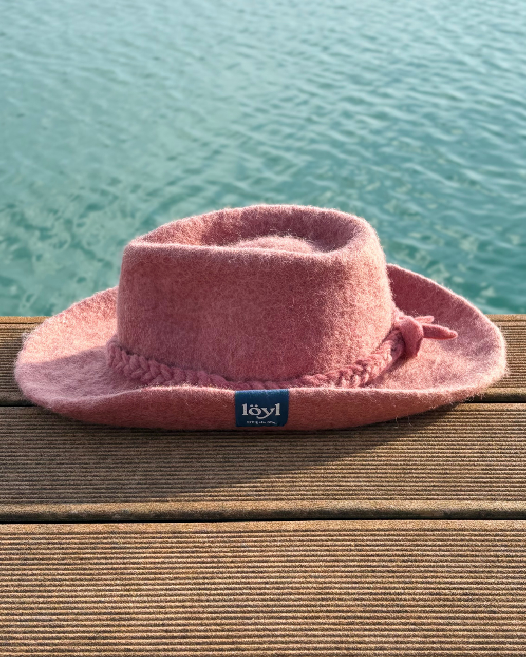 pink cowboy sauna hat from the left