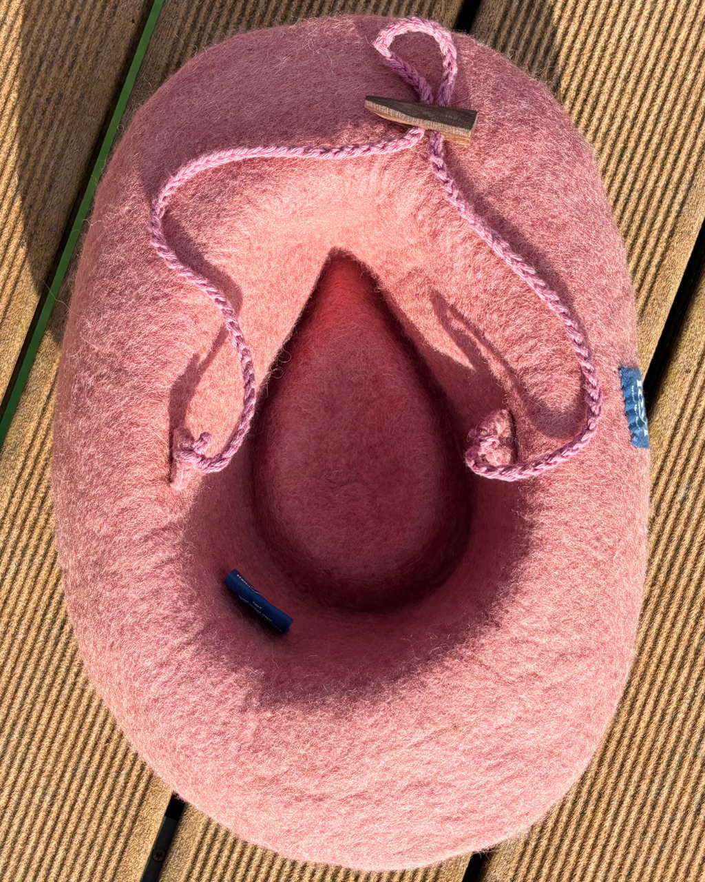 underside of the pink wool felt cowboy sauna hat